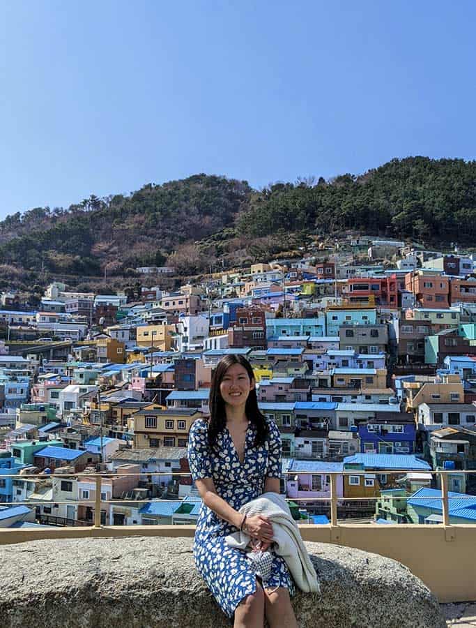 Lucy Koo poses in front of scenic view on vacation
